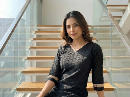 Textured fabric with all-over perforated geometric design Top